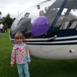A Young WIOE Listener Takes A Pic With WIOE's Chopper 101 At The Family Carnival