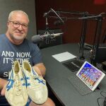 WIOE's Scott Truxell with Olympian Greg Foster's 1984 Silver Medalist Shoes!