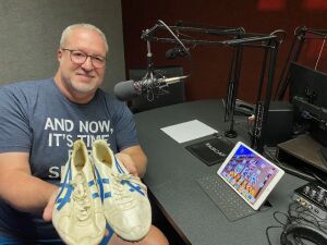WIOE's Scott Truxell with Olympian Greg Foster's 1984 Silver Medalist Shoes!
