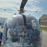 Family Prepares To Fly In Helicopter Lucy